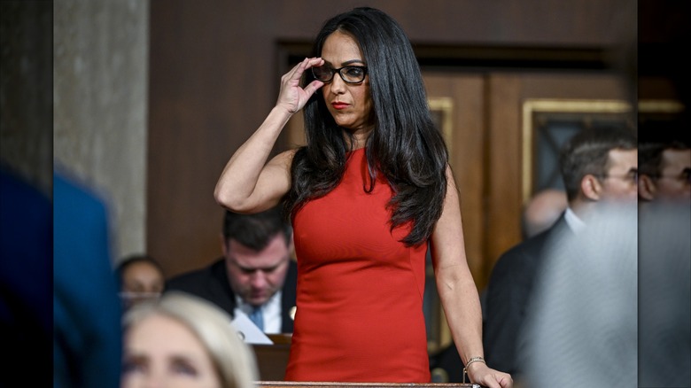 Lauren Boebert adjusting her glasses in a tight red dress at the 2026 State of the Union