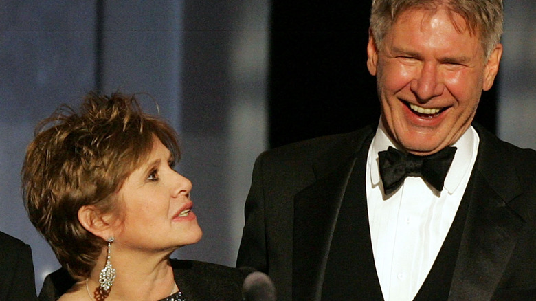 Harrison Ford and Carrie Fisher laughing