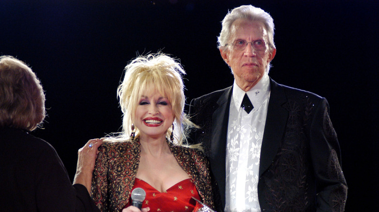 Dolly Parton and Porter Wagoner standing together, older.