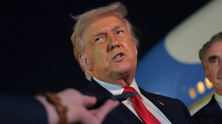 Donald Trump speaks with reporters