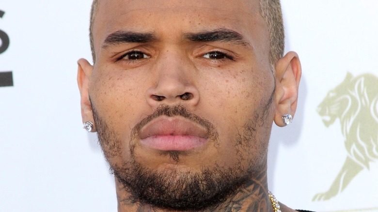 Chris Brown frowning diamond earrings