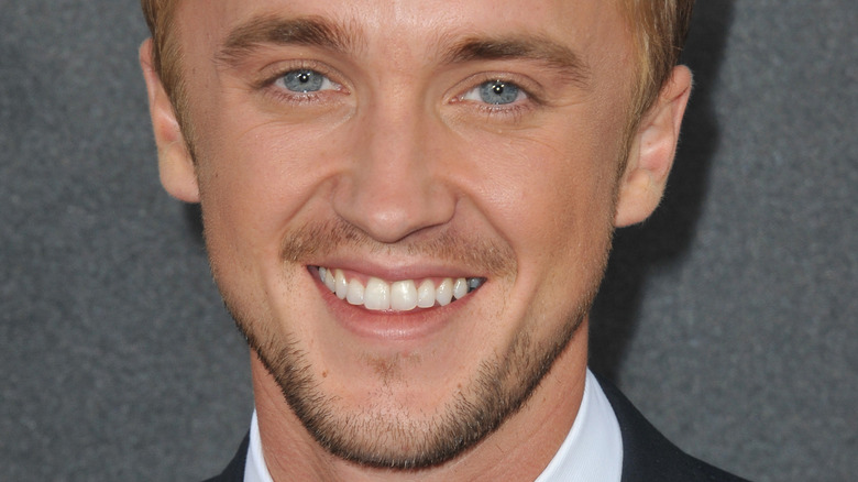 Tom Felton smiles