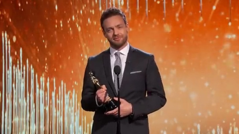 Ross Marquand holding an Oscar on Jimmy Kimmel Live