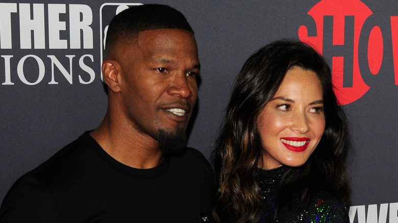 Jamie Foxx and Olivia Munn smiling 