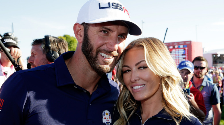 Dustin Johnson poses with Paulina Gretzky