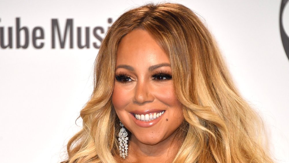 Mariah Carey poses in the press room during the 2018 American Music Awards