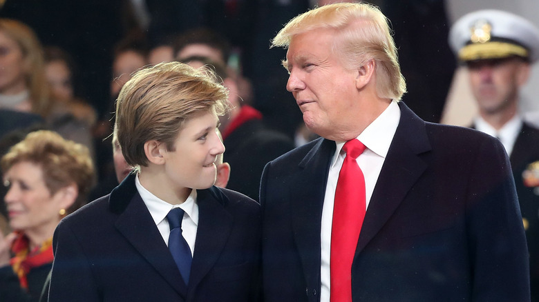 Barron Trump and Donald Trump in suits