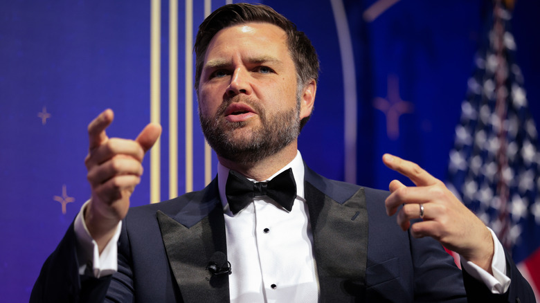 JD Vance gestures with his hands while speaking at a gala.