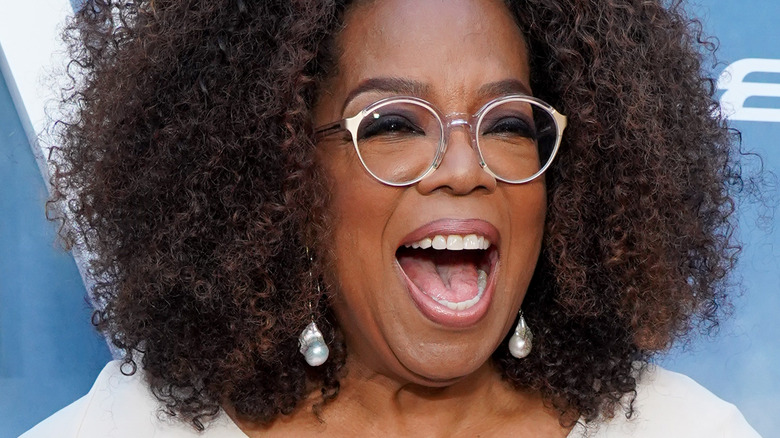 Oprah smiles big