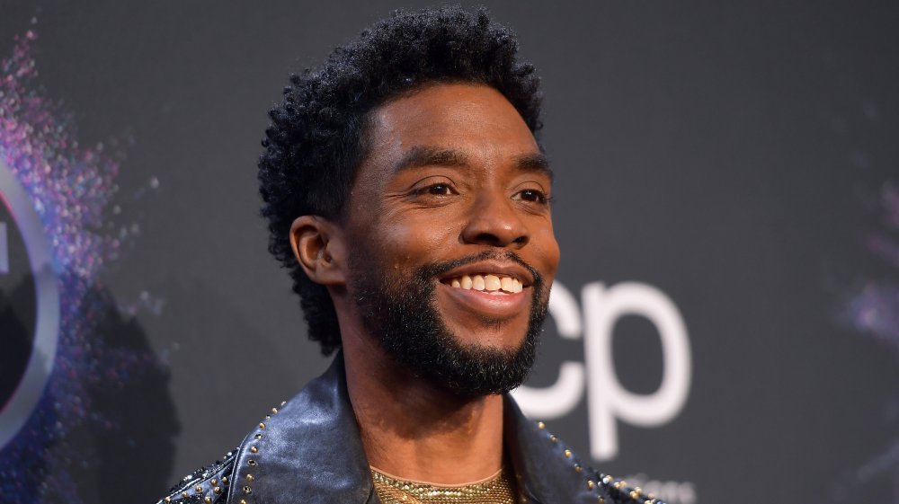 Chadwick Boseman smiling on the AMAs red carpet