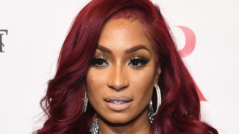 Karlie Redd wearing red hair