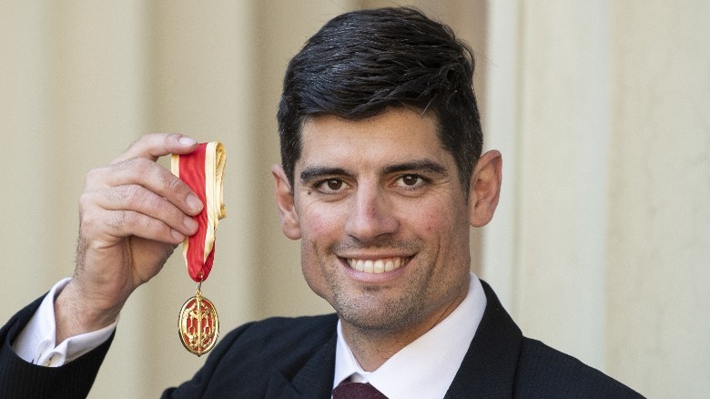 Alastair Cook with knighthood medal