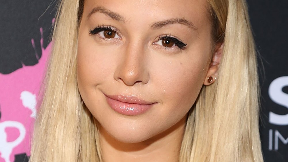 Corinne Olympios smirking 