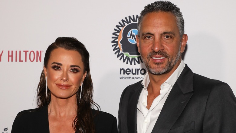 Kyle Richards and Mauricio Umansky smiling on red carpet