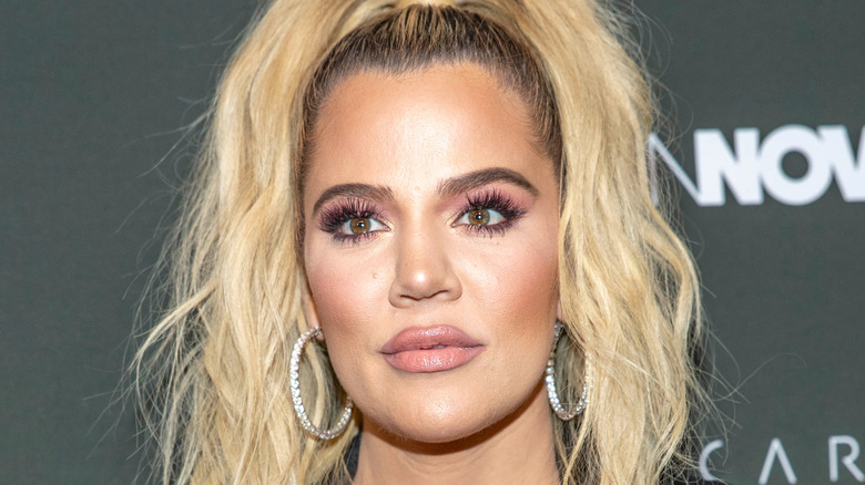 Khloé Kardashian wearing hoop earrings