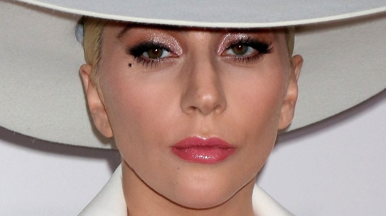 Lady Gaga in a hat, looking serious