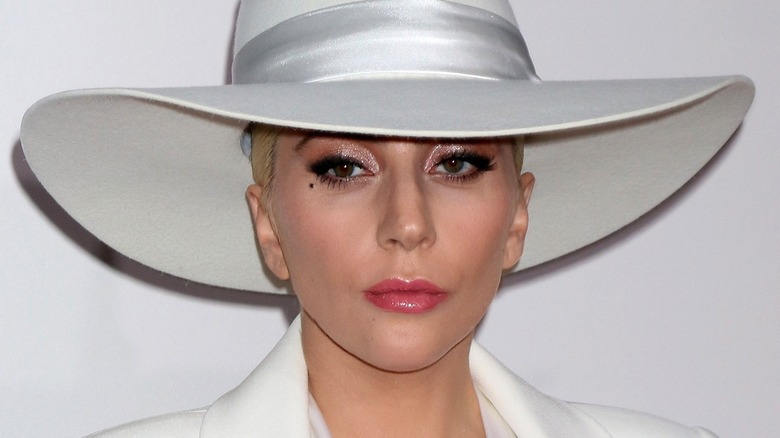 Lady Gaga in a hat, looking serious