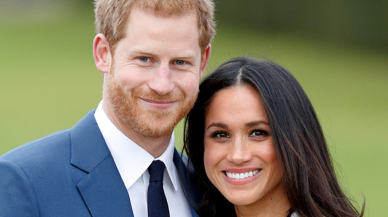 Prince Harry and Meghan Markle smiling