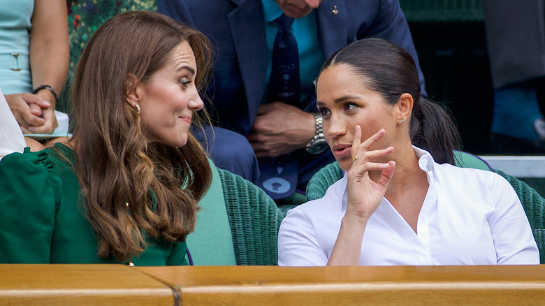 Kate Middleton and Meghan Markle talking