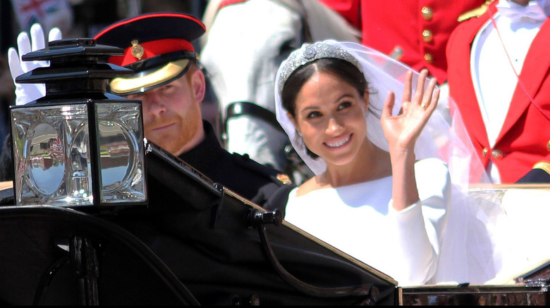Prince Harry and Meghan Markle waving after wedding