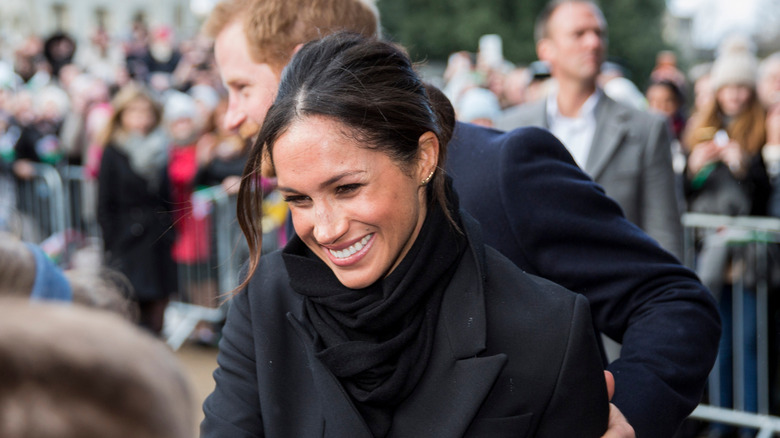 Prince Harry and Meghan Markle greeting fans