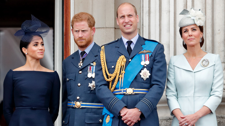 Meghan Markle, Prince Harry, Prince William, and Kate Middleton standing together