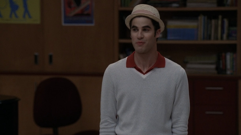 Blaine speaks to the glee club while wearing his boat hat in "Glee"