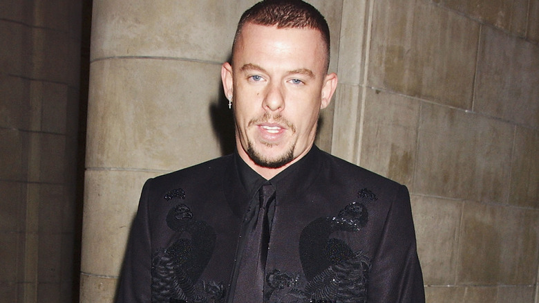 Alexander McQueen posing at event