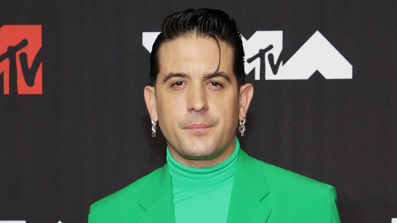 G-Eazy wearing a green jacket