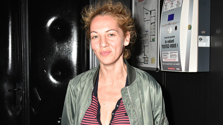 Jennifer Eymere smirking at event