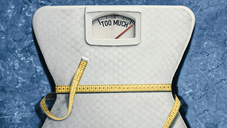 A scale reading too much in the poster for Fit for TV on Netflix