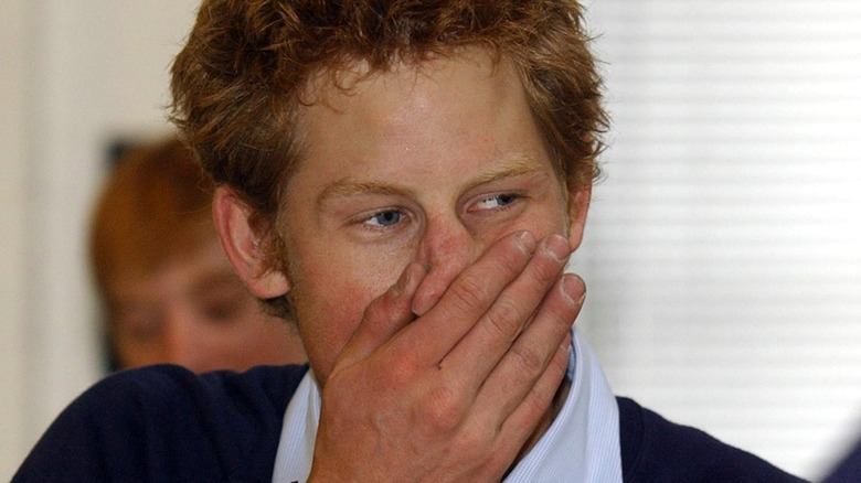 Prince Harry looking shocked, hand to mouth
