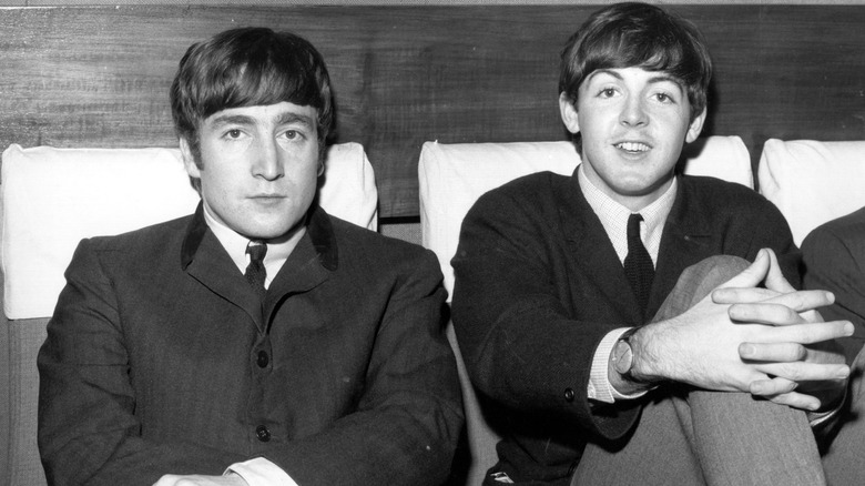 Paul McCartney and John Lennon smiling 