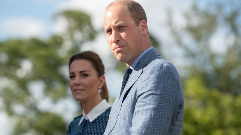 Prince William and Kate Middleton frowning 
