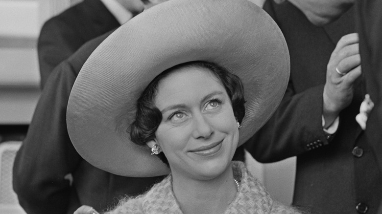 Princess Margaret at an event wearing a big hat and smiling