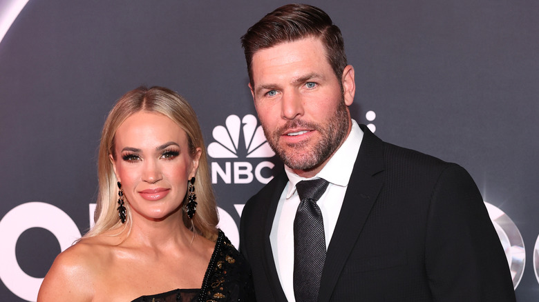 Carrie Fisher and husband Mike Fisher on the red carpet.