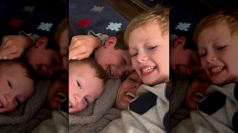 Dylan Dreyer lies with her sons on top of her