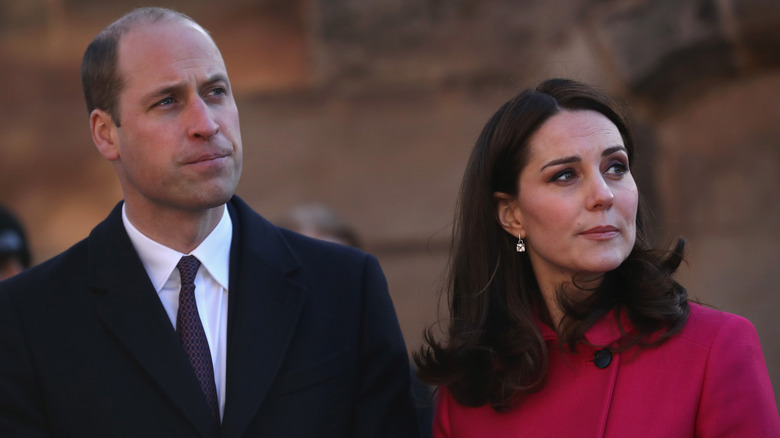 Prince William and Kate Middleton with serious faces