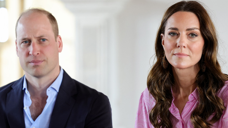 Prince William looking annoyed and Kate Middleton looking sad