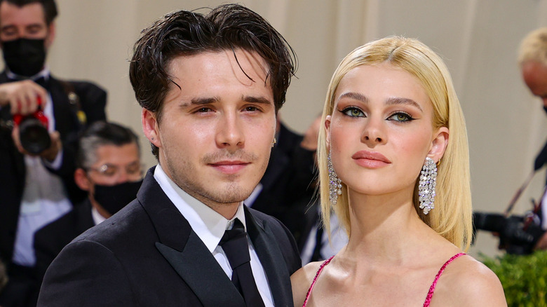 Brooklyn Beckham and Nicola Peltz posing