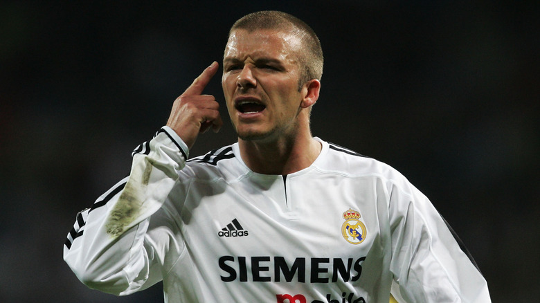 David Beckham pointing at head