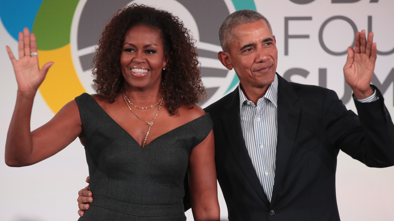 Michelle and Barack Obama waving