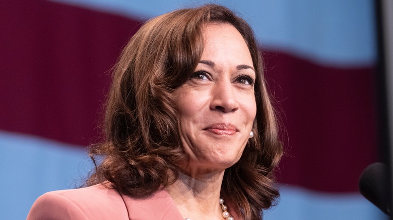 Kamala Harris wearing pearls, smiling