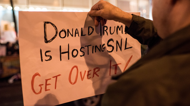 Donald Trump SNL protest response sign