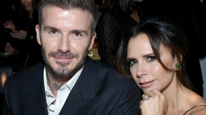 David and Victoria Beckham looking at camera