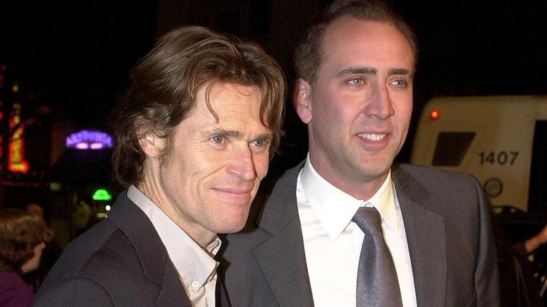 Nicolas Cage with Willem Defoe at the premiere of their film "Shadow of the Vampire" in 2001