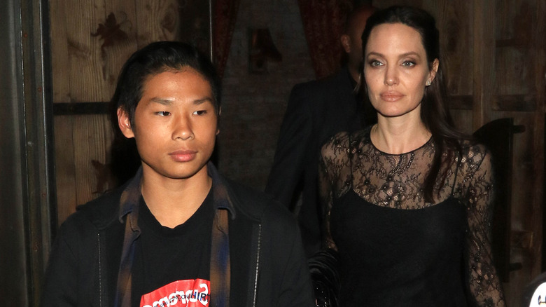 Pax Jolie-Pitt, Angelina Jolie wearing dark clothing
