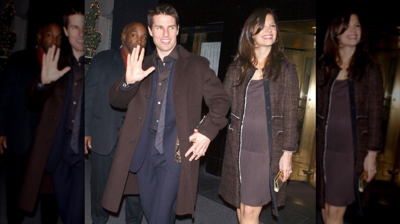 Tom Cruise holding Katie Holmes' hand