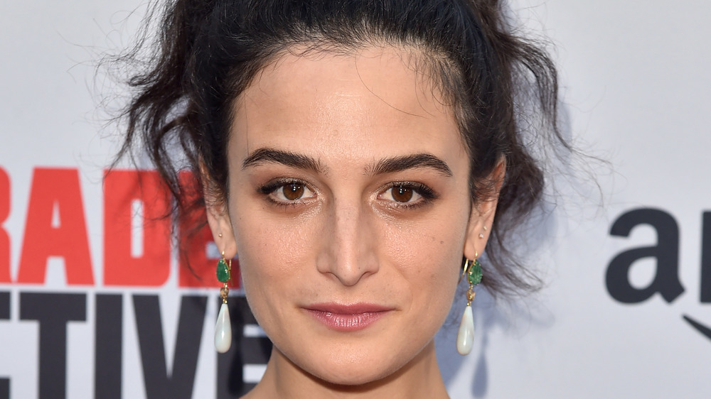 Jenny Slate with a serious expression at an event