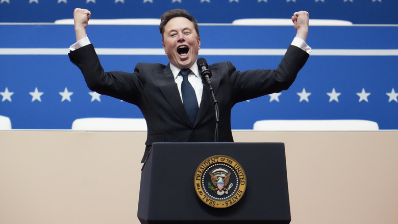Elon Musk throwing his fists in the air at Donald Trump's inauguration